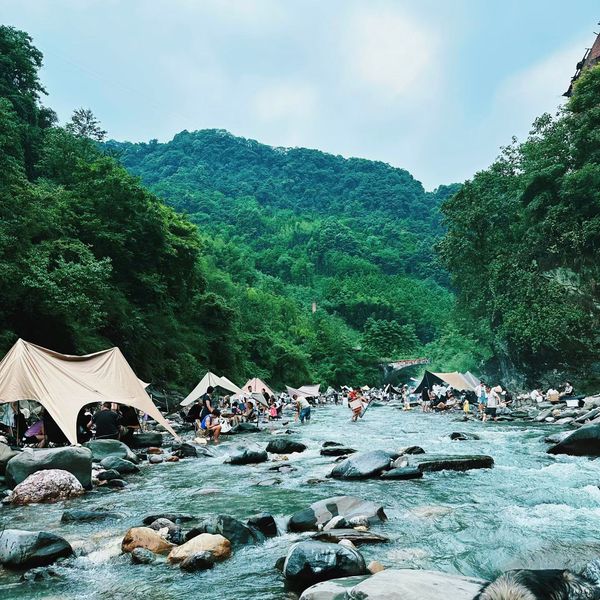 Creekside camping in a mountain valley